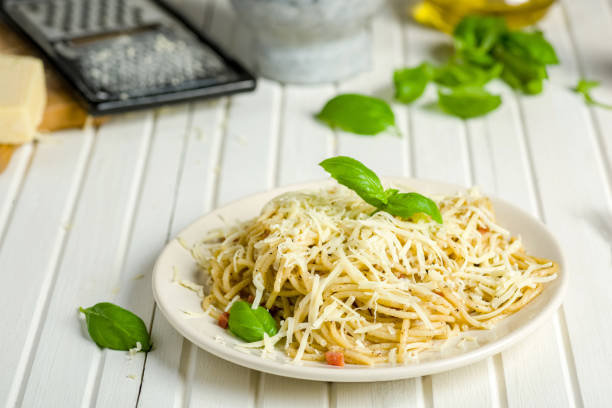 pasta with pepper, bacon and cheese pasta with pepper and bacon sprinkled with grated cheese salt pepper ingredient black peppercorn stock pictures, royalty-free photos & images