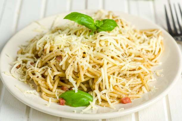 pasta with pepper, bacon and cheese pasta with pepper and bacon sprinkled with grated cheese salt pepper ingredient black peppercorn stock pictures, royalty-free photos & images
