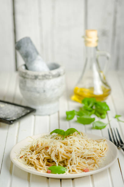 pasta with pepper, bacon and cheese pasta with pepper and bacon sprinkled with grated cheese salt pepper ingredient black peppercorn stock pictures, royalty-free photos & images