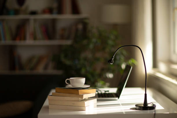 istock Cup of coffee and laptop on the table. 1397590571