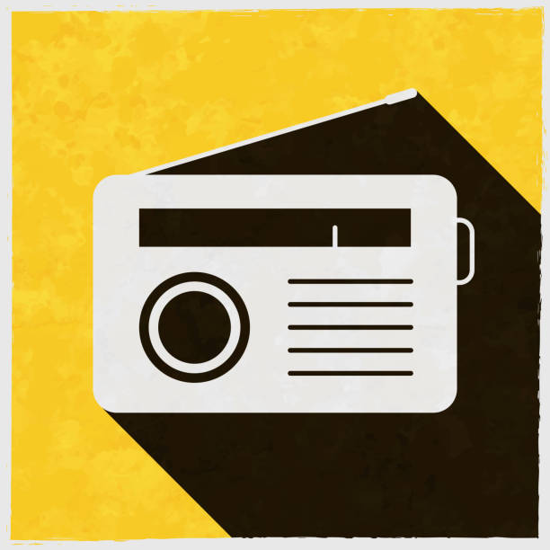 Radio. Icon with long shadow on textured yellow background Icon of "Radio" in a trendy vintage style. Beautiful retro illustration with old textured yellow paper and a black long shadow (colors used: yellow, white and black). Vector Illustration (EPS10, well layered and grouped). Easy to edit, manipulate, resize or colorize. Vector and Jpeg file of different sizes. retro transistor radio clip art stock illustrations