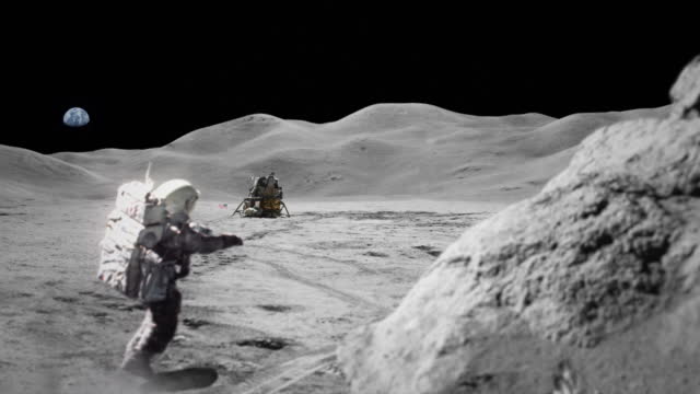 Astronaut exploring the moon. Distant planet Earth in the sky