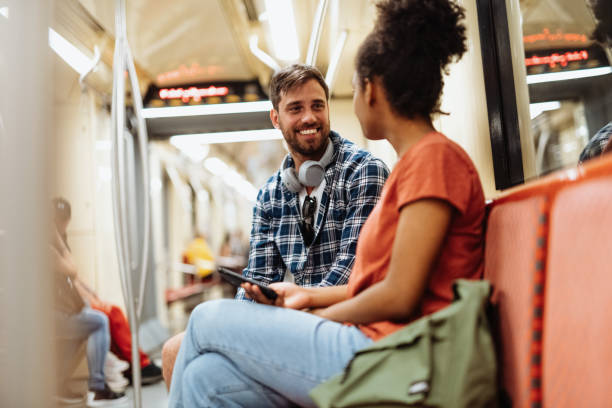istock Commuting by metro, people talking during the ride and smiling 1397593007