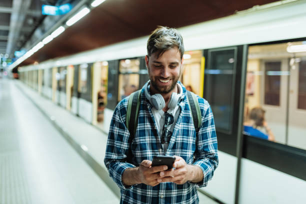 istock Diverse people in city commuting by metro line. Man using smart phone to check the timetable 1397593096