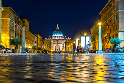 Low angle View of St. Peter's Basilica in Rome, Lazio, Italy on the Via della Conciiazione at night\