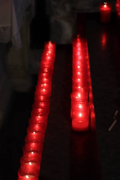 Burning votive candles in a Roman Catholic church in Barcelona, Spain