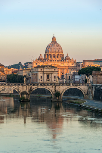 bridge, Ponte Sant Angelo reflected in the Tiber river .