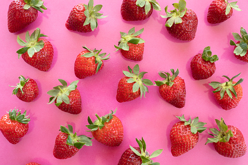 Strawberry on pink background.