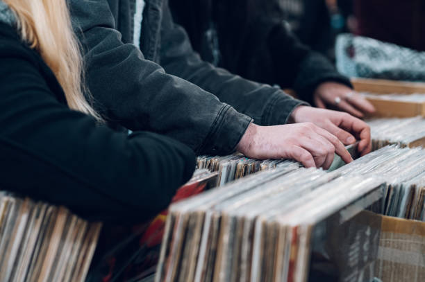 istock Man hands browsing vinyl album in a record store 1397598545