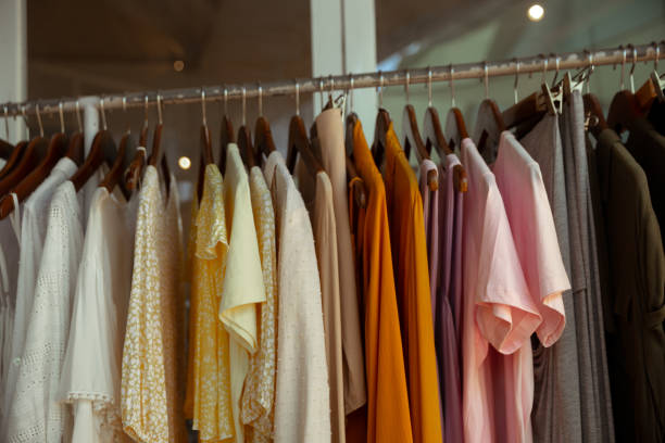 istock Hangers with different female clothes presenting at the retail store. 1397599652