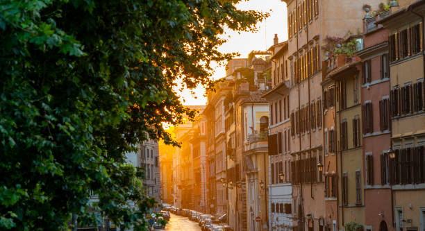 una suggestiva vista all'alba di una via, via di monte rianzo nel quartiere prati nel centro storico di roma - balcony rome window ornate foto e immagini stock