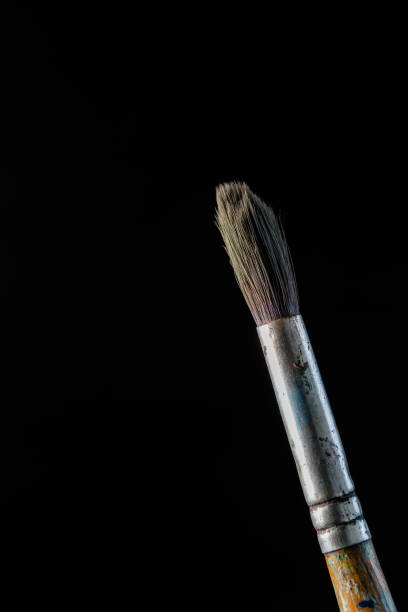 istock Used paintbrush on black background. 1397600950