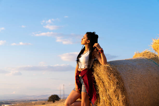 Young women and agriculture bale