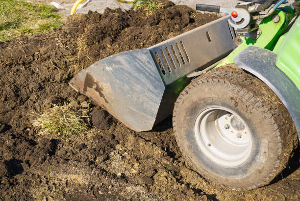 istock Traktor on the field. Mini traktor landscaping at home backyard 1397602131
