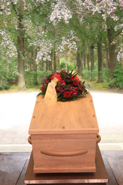 istock A coffin with a flower arrangement in a morgue 1397604845