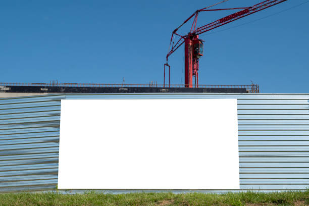 istock Blank white banner for advertisement on the fence of construction site 1397605565
