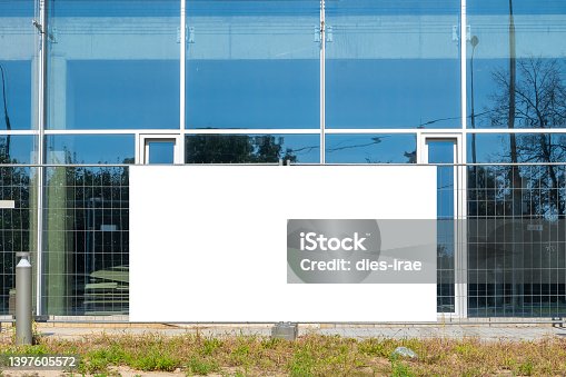 istock Blank white banner for advertisement on the fence of construction site 1397605572