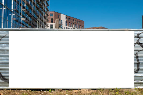 istock Blank white banner for advertisement on the fence of construction site 1397605578