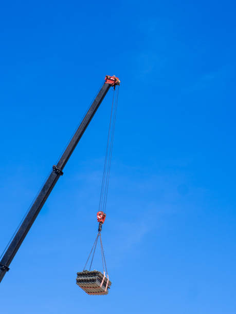 istock crane boom, construction crane with a load at a height 1397605675