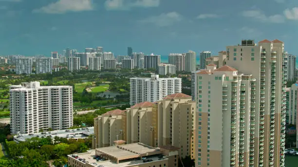 Aerial view of modern condo towers in Aventura, Florida on a bright sunny day