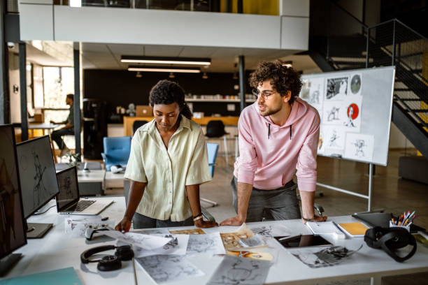 istock Team of illustrators working in the office on a new mobile app 1397606407