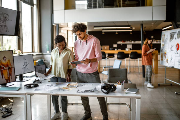 istock Team of illustrators working in the office on a new mobile app 1397606462