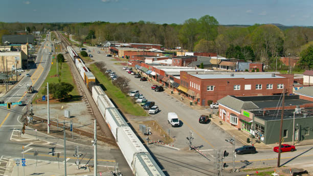 istock Freight Train Passing Through Bremen, GA - Aerial 1397608413