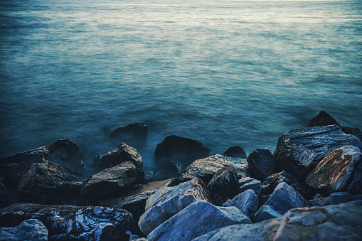 Beautiful rocky beach at sunset on a Greek island