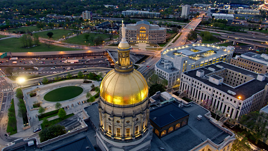Aerial shot of Georgia State Capitol in Atlanta, Georgia on a early spring morning before dawn.

Authorization was obtained from the FAA for this operation in restricted airspace.