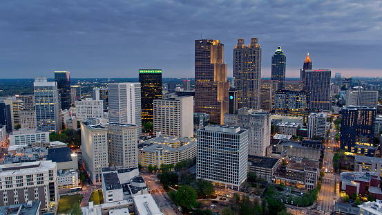 Aerial shot of downtown skyscrapers in Atlanta, Georgia on spring morning before sunrise. \n\nAuthorization was obtained from the FAA for this operation in restricted airspace.