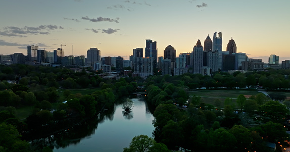 Aerial shot of Atlanta, Georgia at dusk, looking across  Piedmont Park towards the Midtown skyline. 

Authorization was obtained from the FAA for this operation in restricted airspace.