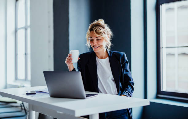 istock Smiling Business Woman Working On A Laptop Computer In Her Office 1397610357
