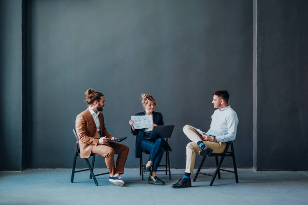 istock Group of Businesspeople Analyzing Business Graphs and Documents Together 1397610400