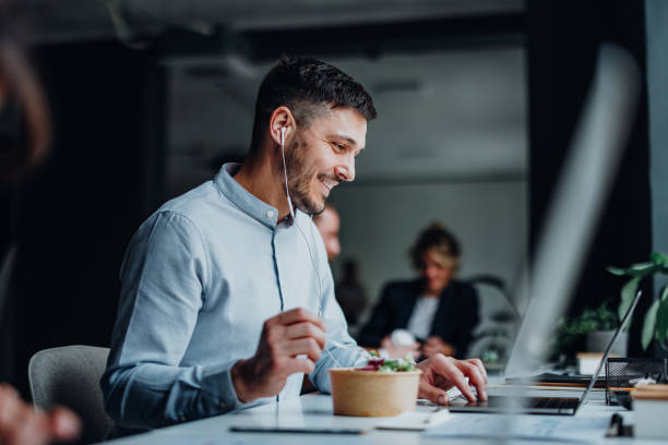 Happy Business Man Talking On A Video Call During A Lunch Break In A Office