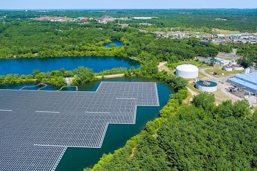 Alternative renewable energy of photovoltaics the solar power plant floating on the water in lake aerial view