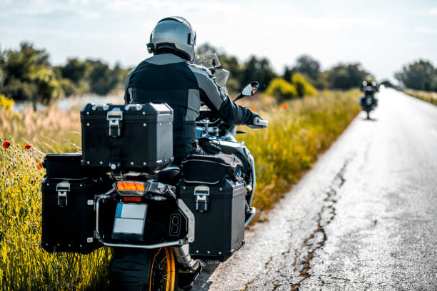 istock Two friends on motorbikes enjoying weekend getaway 1397615452