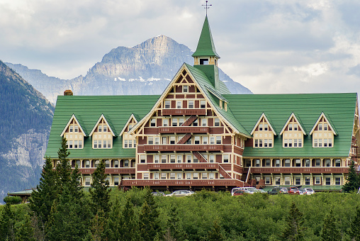 Waterton, Alberta Canada- June 16 2010: The Historic Prince of Wales Hotel sits hillside amongst the mountains of Glacier National Park.