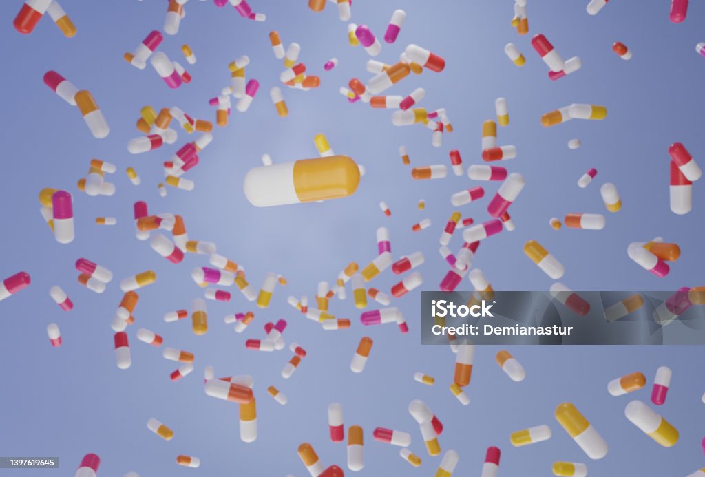 A group of antibiotic pill falling on a blue background. Healthcare and medical 3D concept. Generic Drug Stock Photo