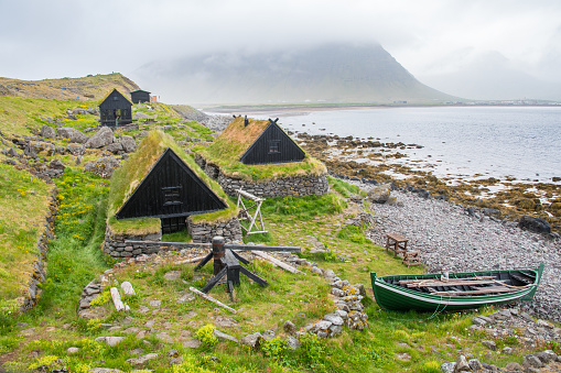 the old fishing cottages of Osvor in Bolungarvik bay in west Iceland