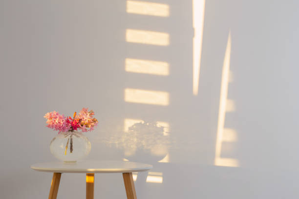 istock spring flowers in glass vase on background white wall in sunlight 1397622650