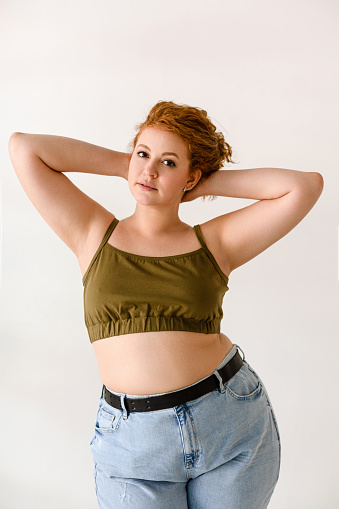 Studio shot of young red hair woman