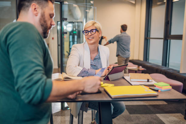 istock Two business colleagues working together in the office 1397623025