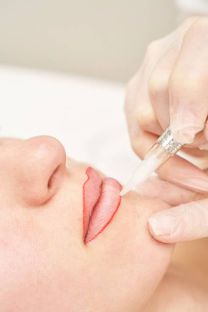 istock Permanent makeup. Beauty spa procedure. young woman. Face tattoo 1397623397
