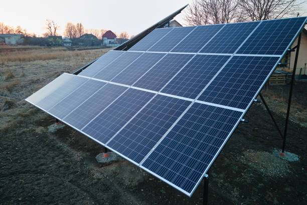 istock Solar photovoltaic panels mounted on stand-alone frame on backyard ground for generating of clean ecological electric energy. Concept of autonomous house 1397628955