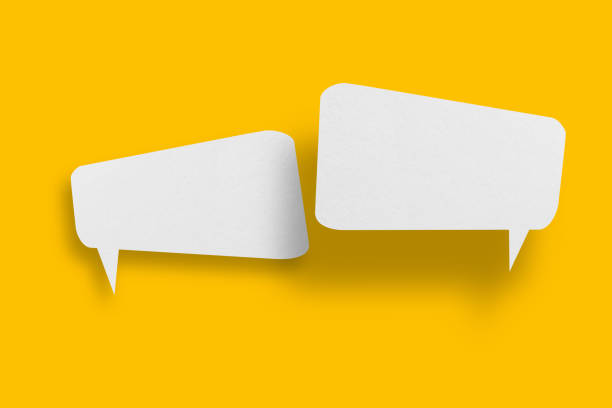 istock White paper in speech bubble shape set against yellow background. 1397632239