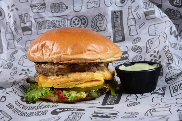 istock Beef Burger Sandwich with Salad Lettuce Tomato Cheese and Dressing 1397632891