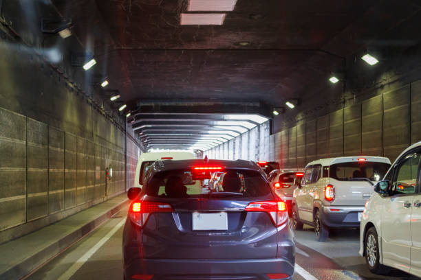 Image of a car stuck in a tunnel Background material tail light stock pictures, royalty-free photos & images