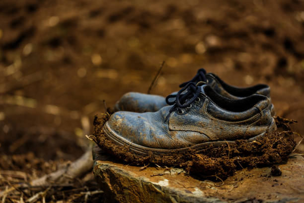 istock Old dirty boots on the rock, 1397634909