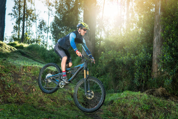 istock Man jumping in a forest on his mountain bike 1397635869
