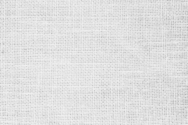 istock White fabric jute hessian sackcloth canvas woven gauze texture pattern in light white color blank. Natural linen and cotton cloth texture as clean background empty for decoration. 1397638517